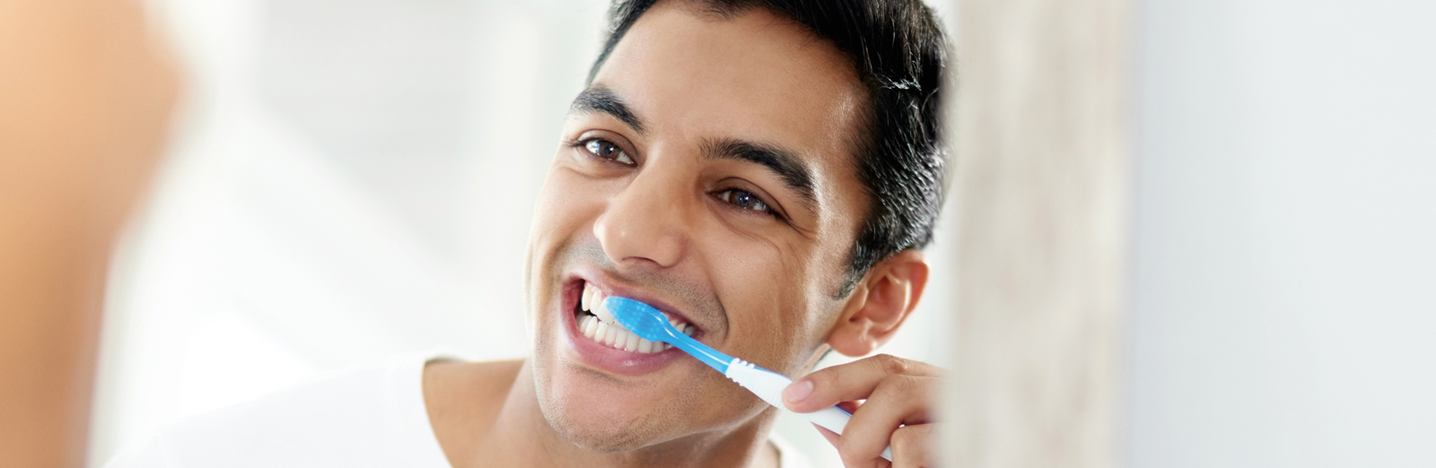 man-brushing-teeth-1600x522.jpg