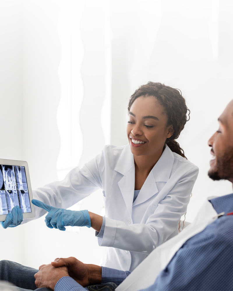 dentist-and-patient-reviewing-x-rays-800x1000.jpg