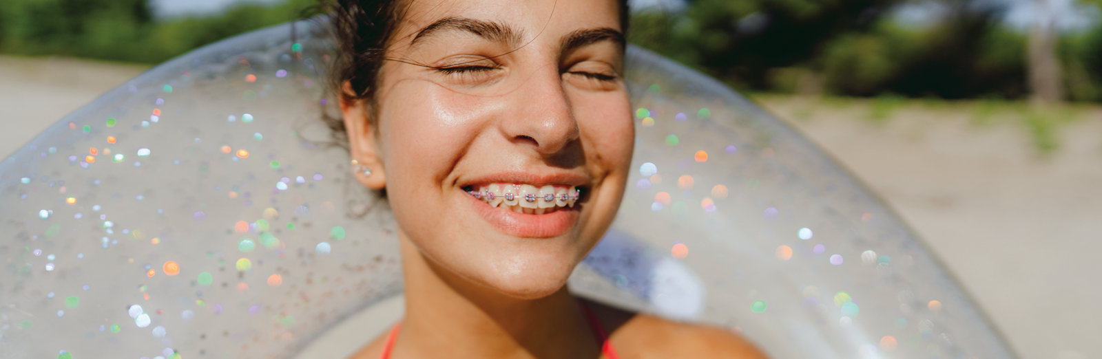 girl-with-braces-smiling-1600x522.png