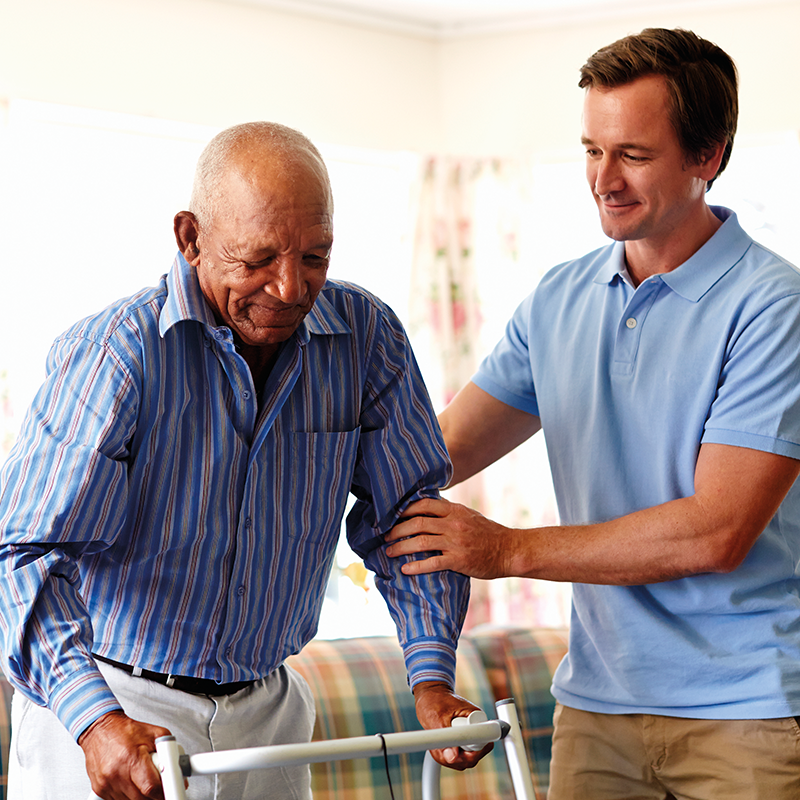 man-helping-older-man-with-walker-800x800.png