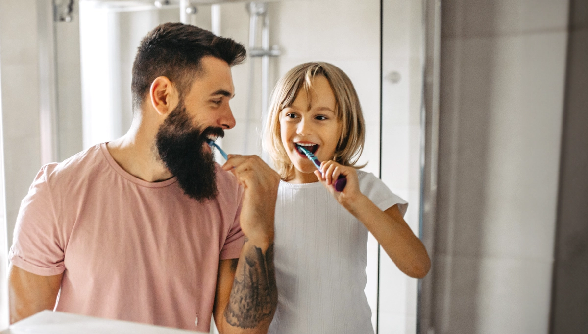 father-and-daughter-brushing-their-teeth-1200x683.webp