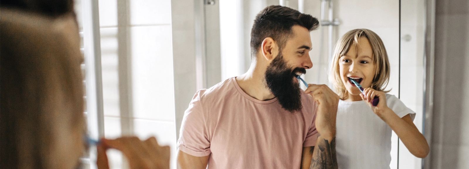 father-and-daughter-brushing-their-teeth-1600x578-2.webp