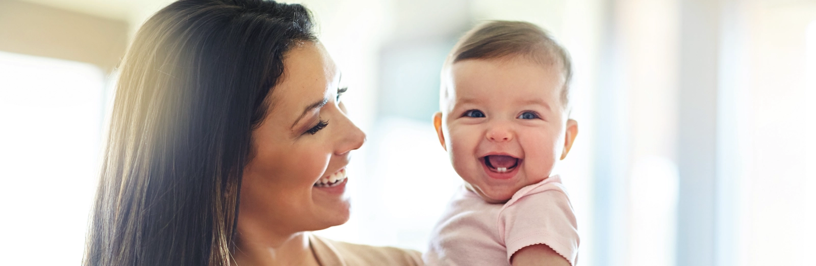 mom-and-baby-laughing-together-1600x522.webp