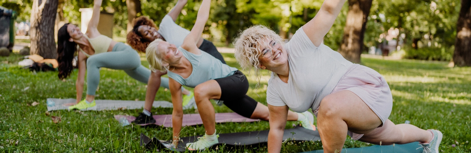 woman-doing-yoga-in-the-park-1600x522.webp