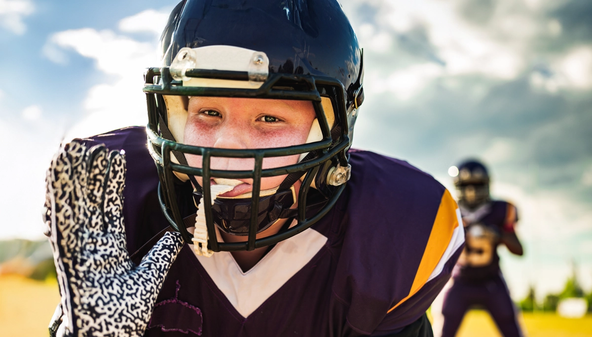 young-boy-playing-football-1200x683.webp