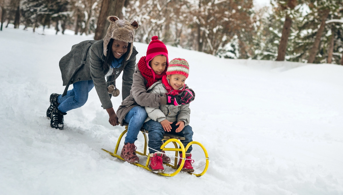 mom-pushing-on-a-sled-1200x683.webp