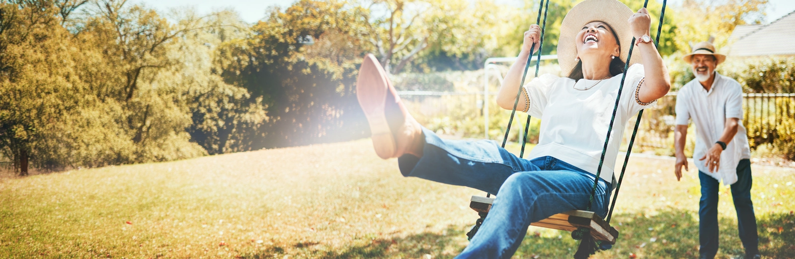 man-pushing-woman-on-swing-1600x522.webp